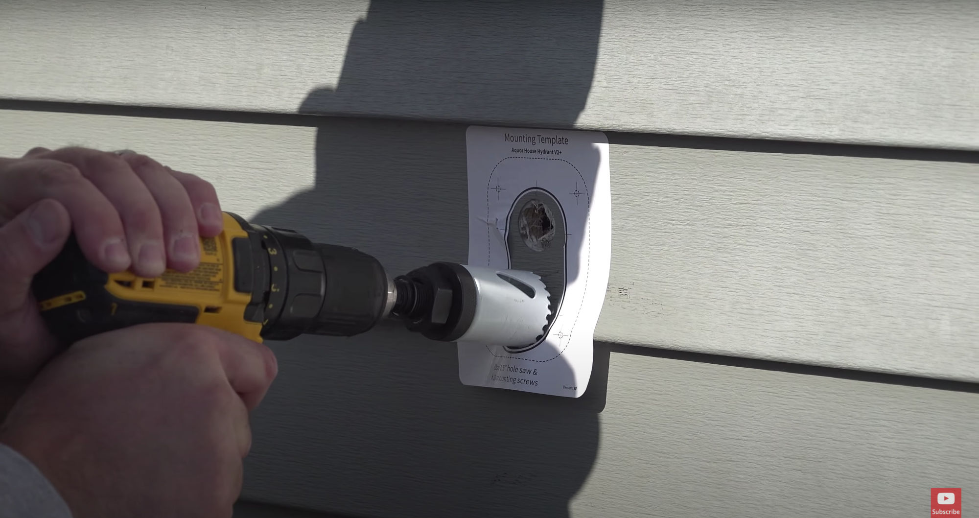 Cutting the V2+ entry hole with a hole saw.