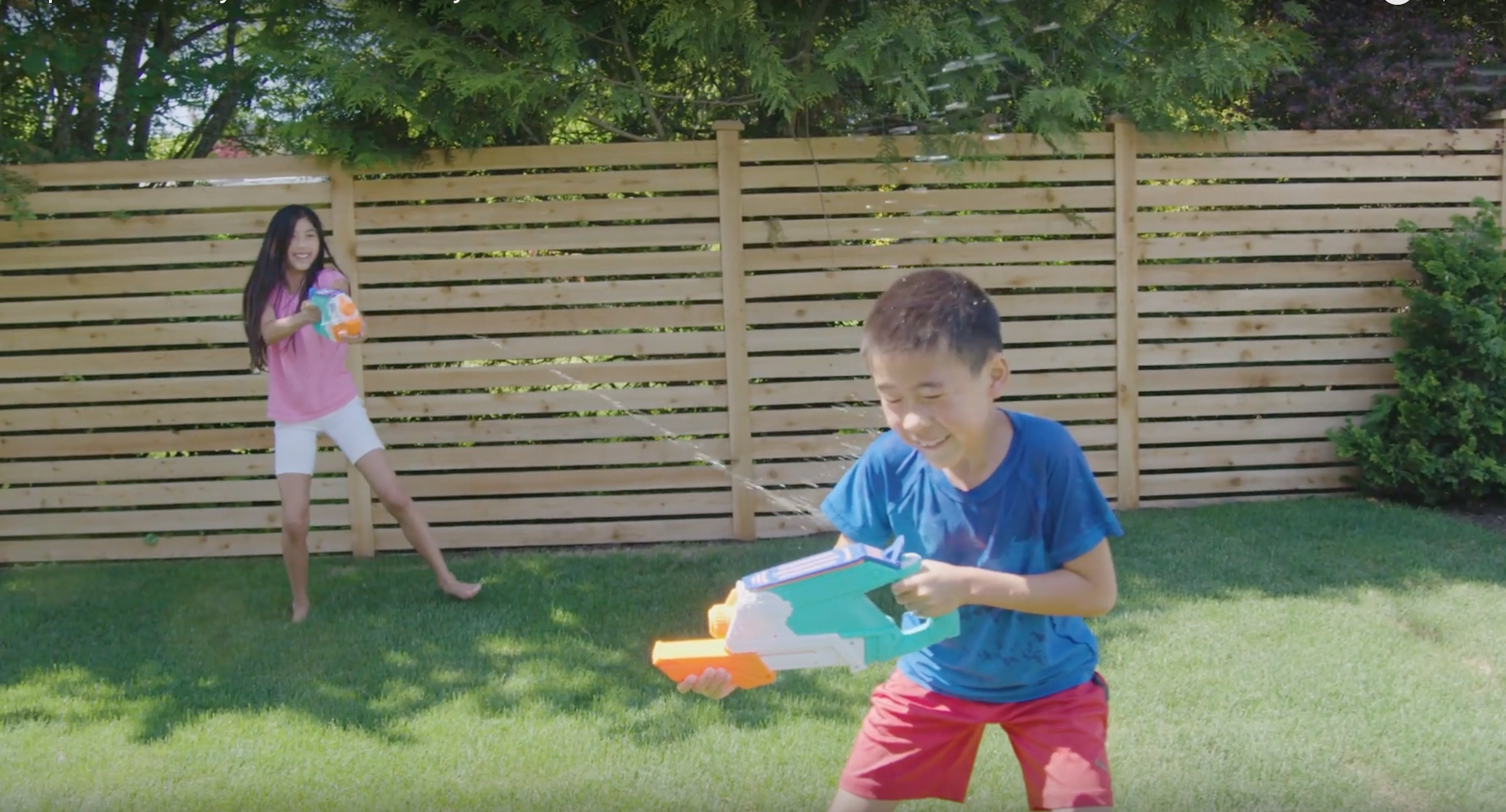 Family fun outdoor water fight