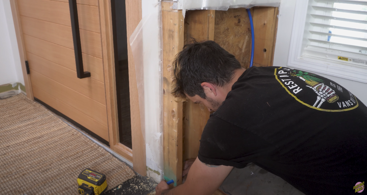 Finishing up the plumbing connection.
