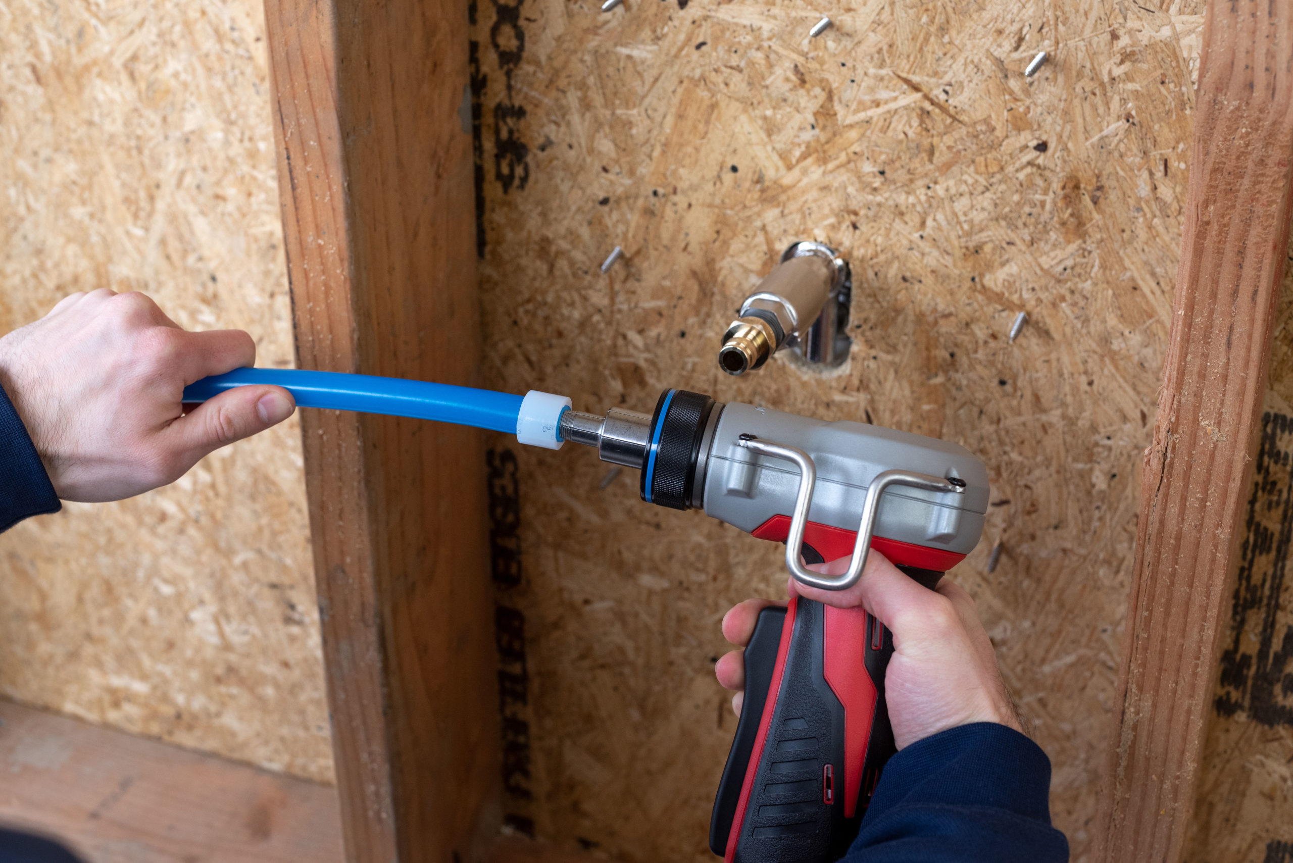 Installing PEX plumbing to connect hose bib