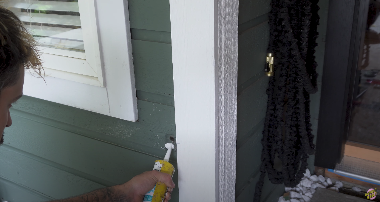 Putting down caulk to help secure the mounting block in place