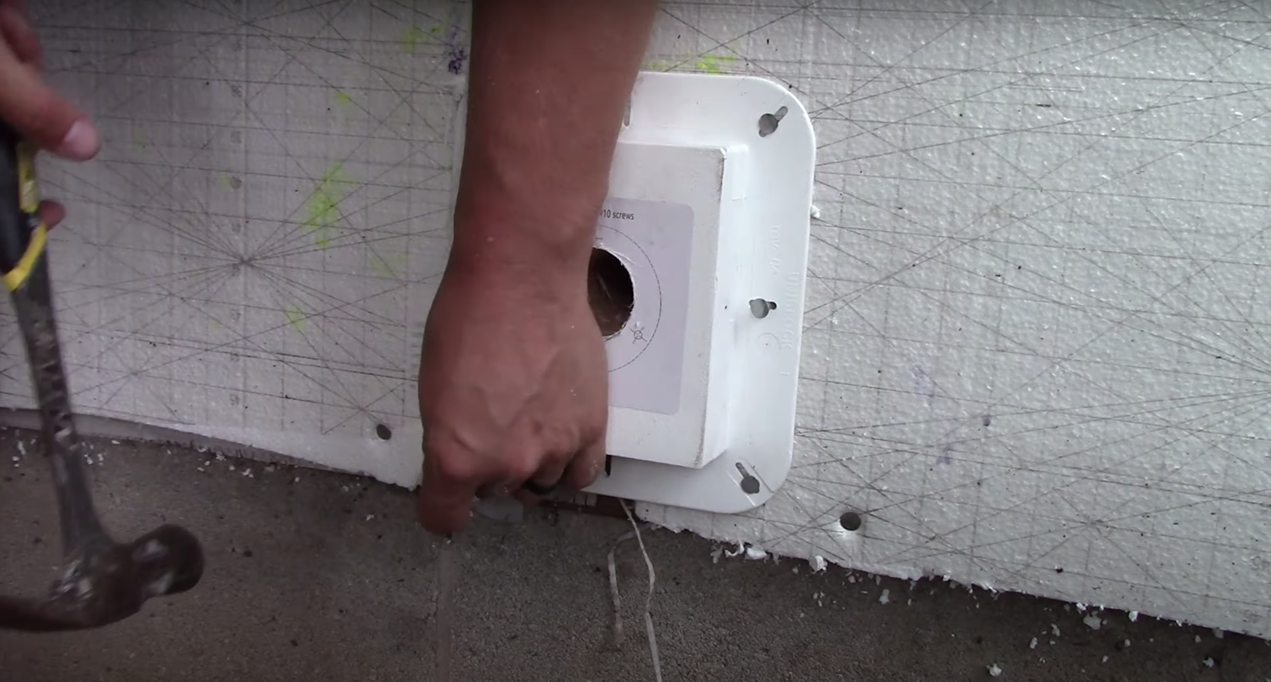 Securing the mounting block to the exterior using roofing screws