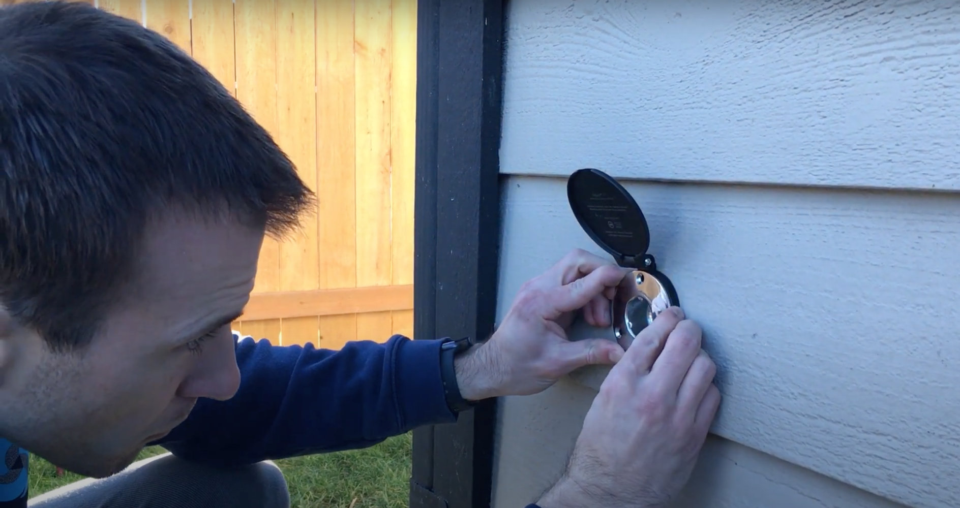 Sliding the black cover into place.