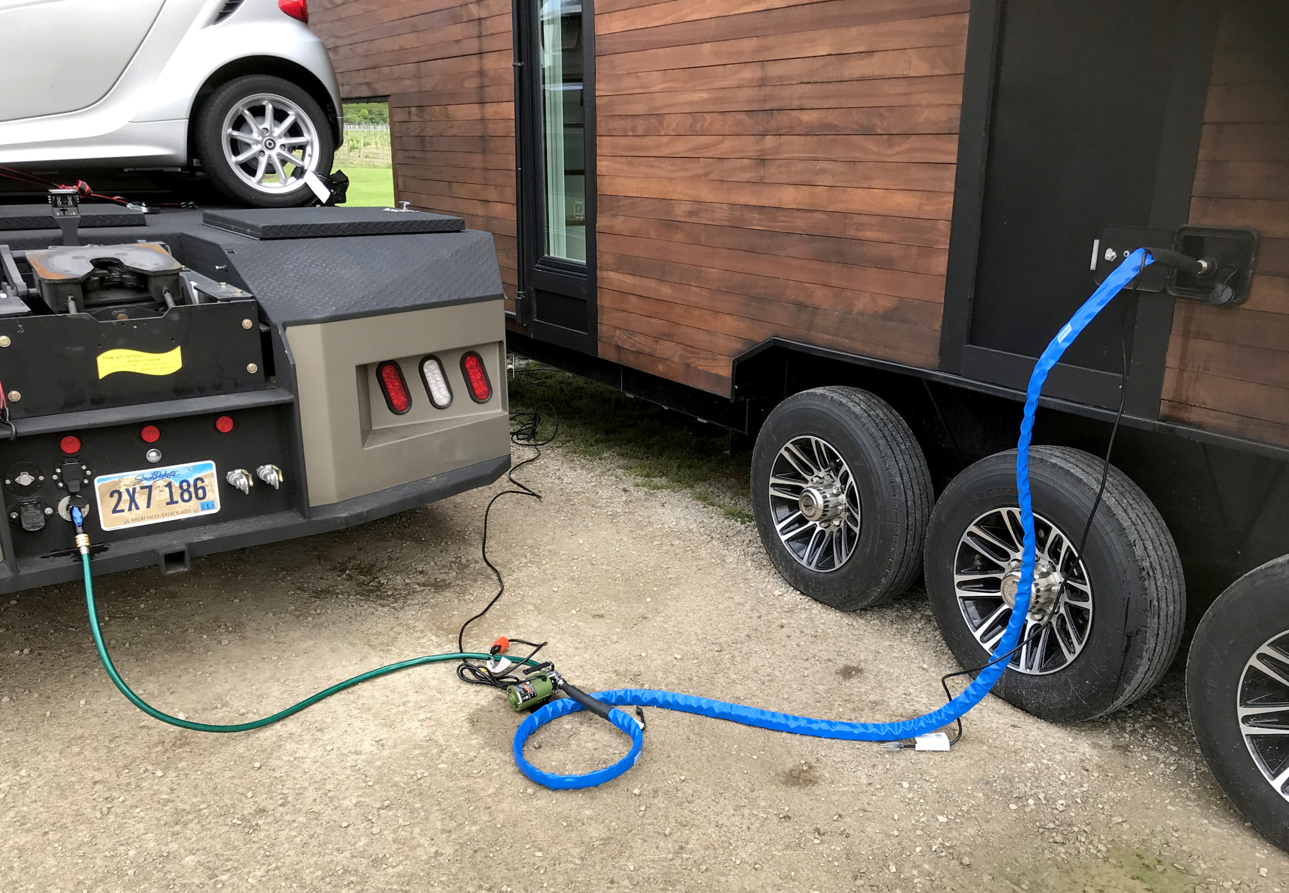 Filling the tiny with water from the truck via the Aquor RV City Water