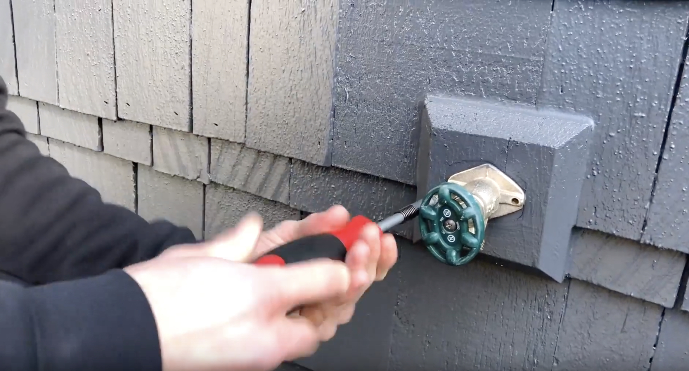 Unscrewing the old hose bib