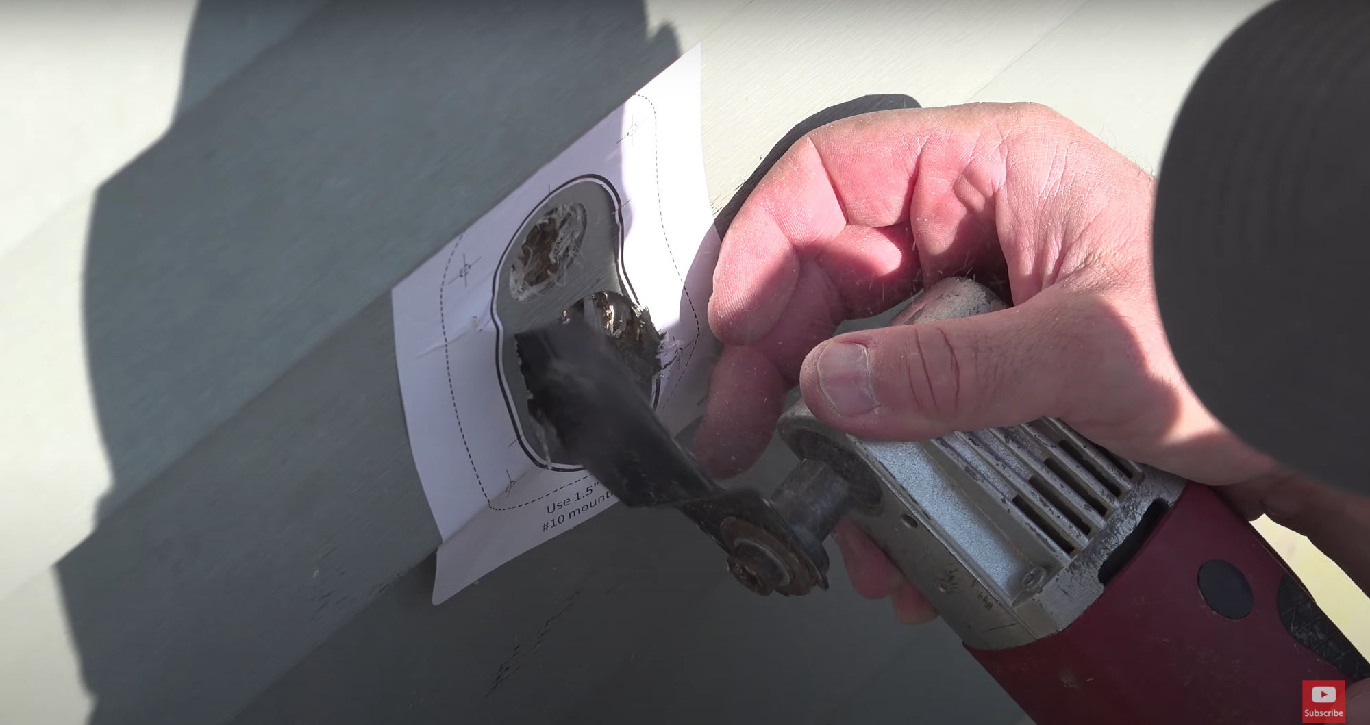 Using an oscillating saw to complete the entry hole.
